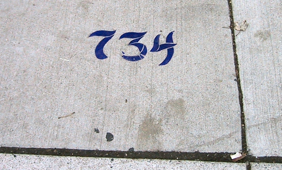Porcelain numbers in sidewalk